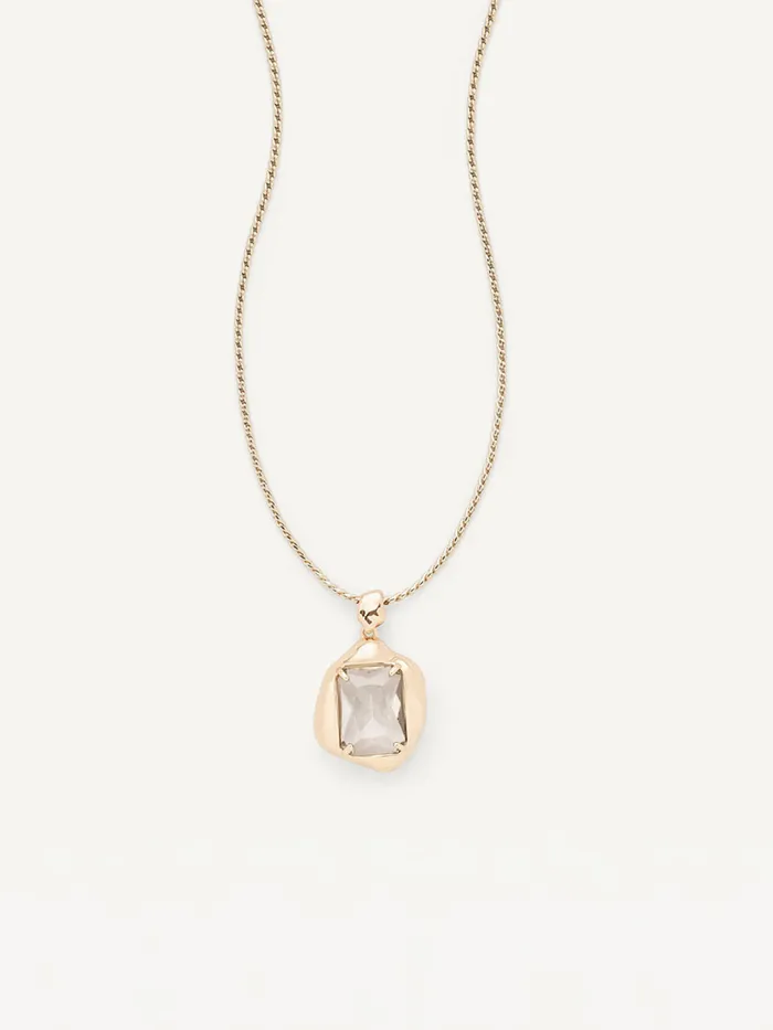 Connor Necklace: a faceted stone pendant in an organically shaped gold setting on a fine chain